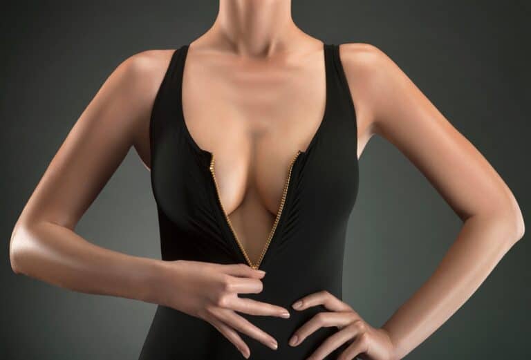 woman unzipping black dress