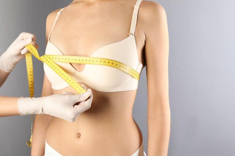 surgeon measuring breast size