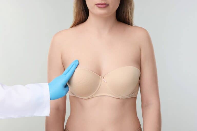 woman in bra breast examination