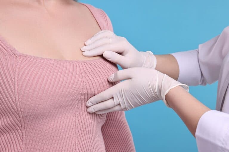 woman breast exam by doctor