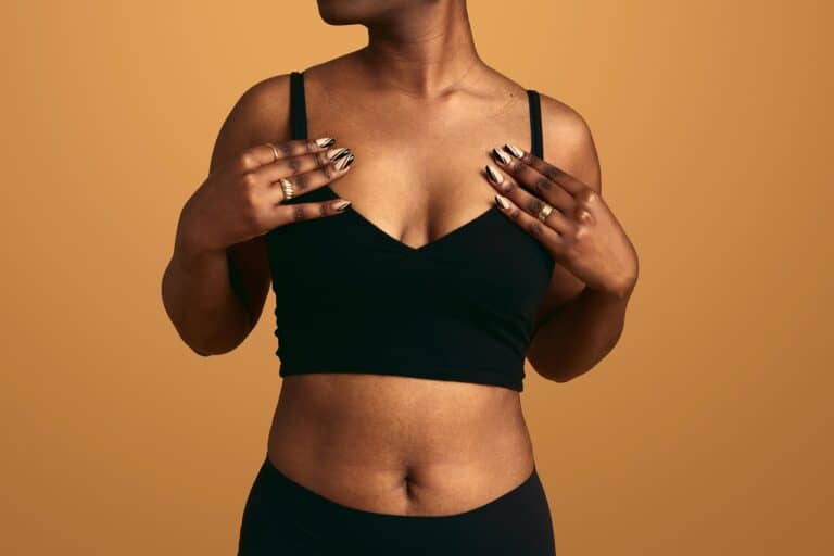 slim black woman in black surgical bra
