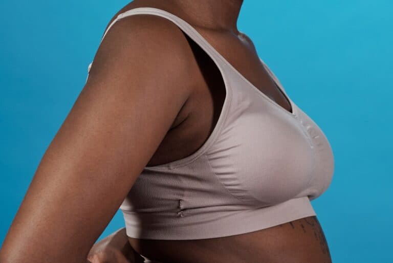 greyish surgical bra in blue background